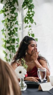 Happy Woman in Red Sequin Dress Portrait Phone Wallpaper