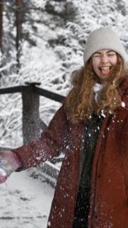 Funny Girl Having Fun in Winter Snow Phone Wallpaper
