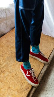 Playful Cookie Monster Socks and Red Sneakers Mobile Wallpaper