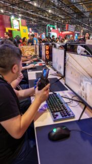 Immersive E-Sports Gaming Setup at Convention Center Wallpaper