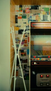 Retro Arcade Gaming Aesthetic with Vibrant Poster Wall Wallpaper