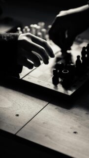 Dramatic Chess Match Strategy Black and White Phone Wallpaper