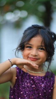 Beautiful Little Girl in Purple Sequin Dress Mobile Wallpaper
