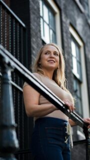Blonde Woman Standing by Urban Stairs Mobile Phone Wallpaper