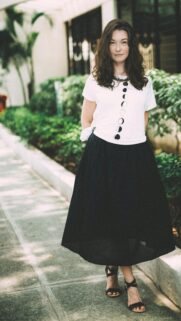 Woman in Moon Phase T-Shirt and Black Skirt Aesthetic Phone Wallpaper