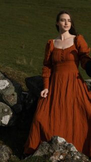 Stunning Woman in Rust Orange Cottagecore Dress Aesthetic Wallpaper