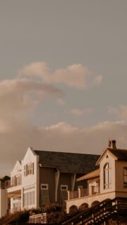 Coastal Beach House Exterior Under Soft Golden Hour Sky Wallpaper
