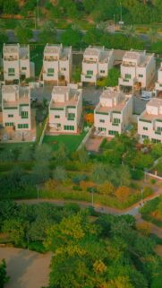 Aerial View of Modern Suburban Villas and Lush Park Landscape Wallpaper