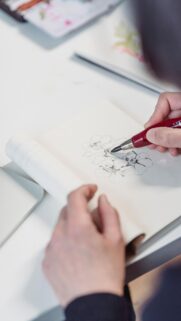 Artist Sketching Beautiful Flowers Hand-Drawn Floral Art Wallpaper