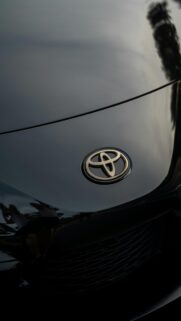 Minimalist Black Toyota Car Emblem Close-up Phone Wallpaper