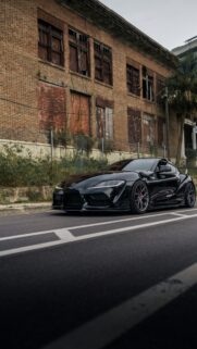 Aggressive Black Toyota Supra A90 JDM Sports Car Mobile Wallpaper