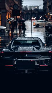 Black Ferrari Rainy City Street Luxury Aesthetic Manifestation Wallpaper