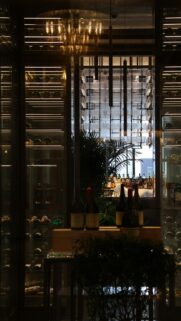Luxury Wine Cellar Interior with Elegant Golden Lighting Wallpaper