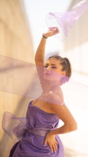 Stunning Portrait of a Woman in Purple Fashion Dress Wallpaper