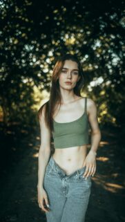 Stunning Young Woman in Green Crop Top Portrait Wallpaper
