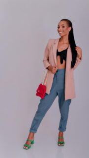 Stunning Fashion Model in Chic Blazer and Blue Trousers Phone Wallpaper