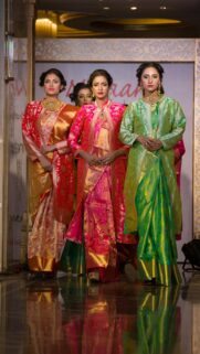 Elegant South Asian Fashion Models in Traditional Silk Attire Wallpaper