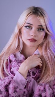 Stunning Blonde Woman in Pink Fur Hoodie Fashion Portrait Wallpaper