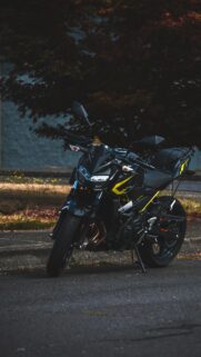 Kawasaki Z Series Sport Bike Parked at Twilight Mobile Wallpaper