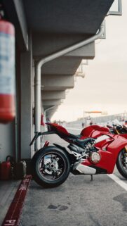 Red Ducati Panigale Superbike in Racing Pit Lane 4K Wallpaper