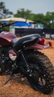 Rugged Maroon Royal Enfield Motorcycle Off-Road Mobile Wallpaper