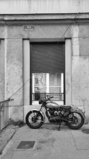 Vintage Motorcycle Parked at Rue Pouteau Street Wall Wallpaper