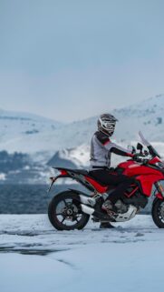 Ducati Multistrada Adventurer on Snow Covered Mountain Road Wallpaper