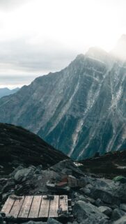 Majestic Mountain Peak with Wooden Trail Platform Mobile Wallpaper