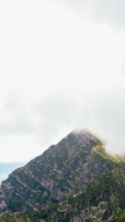 Misty Mountain Peak Under Cloudy Sky High-Resolution Mobile Wallpaper
