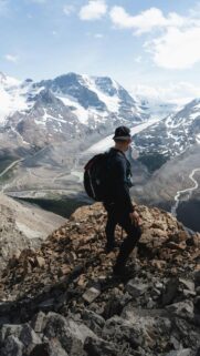 Hiker Overlooking Athabasca Glacier Mountain Peak Mobile Wallpaper