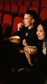 Couple Enjoying Popcorn at the Cinema High Quality Mobile Wallpaper
