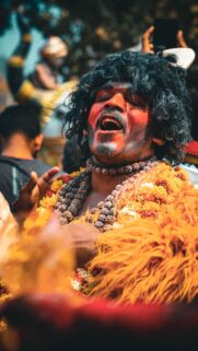 Vibrant Indian Festival Performer Ritual Art Mobile Wallpaper