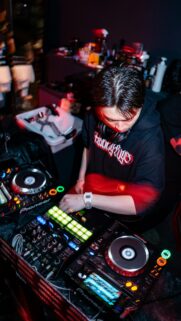 DJ Playing Music at Nightclub Electronic Dance Party Mobile Wallpaper