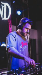 DJ Performing Electronic Music Live at Nightclub Phone Wallpaper