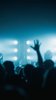 Concert Crowd Silhouette with DJ and Stage Lights Phone Wallpaper