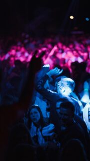 Vibrant Nightclub Party Crowd with Neon Blue and Pink Lights Wallpaper