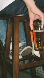 Aesthetic Pub Vibe with Checkerboard Slip-ons and Beer Mobile Wallpaper