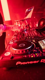 Neon Red DJ Controller Music Setup High-Quality Mobile Wallpaper
