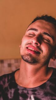 Relaxed Young Man With Closed Eyes Aesthetic Portrait Phone Wallpaper