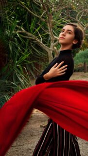 Elegant Woman with Red Fabric Artistic Portrait Phone Wallpaper
