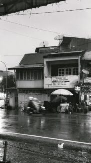 Rainy Street Scene with Vintage Shophouse Black and White Wallpaper
