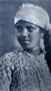Vintage Portrait of a Young Woman in Traditional Headscarf Wallpaper