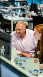 Professional Collaboration in a Modern Office Workspace Wallpaper
