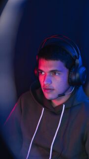 Gamer Focused in Neon Lighting High Quality Mobile Wallpaper