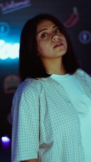 Stylish Woman in Plaid Shirt Urban Neon Light Portrait Wallpaper