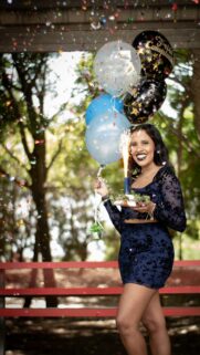 Joyful Birthday Celebration Woman with Balloons and Sparkler Wallpaper