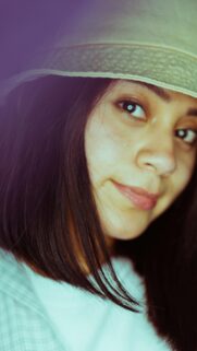 Stunning Portrait of a Young Woman in a Bucket Hat Wallpaper