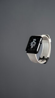 Minimalist Black Smartwatch with White Strap Floating Mobile Wallpaper