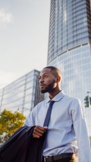 Professional Businessman in City Skyline Mobile Wallpaper