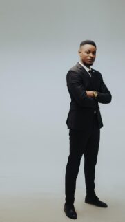 Confident Professional Man in Sharp Black Suit Mobile Wallpaper